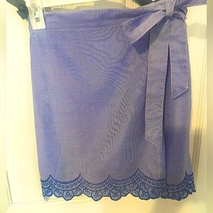 Women’s wrap skirt, striped and embroidered on the bottom